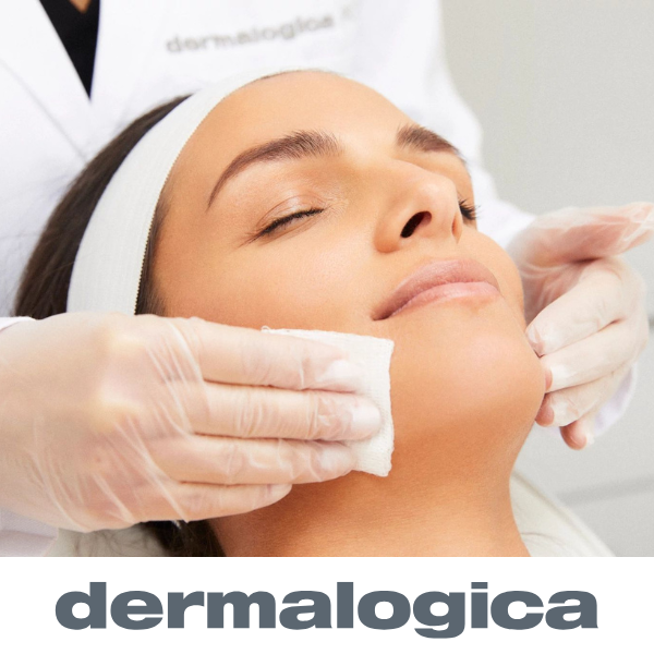 Woman receiving a professional Dermalogica facial at a skincare clinic